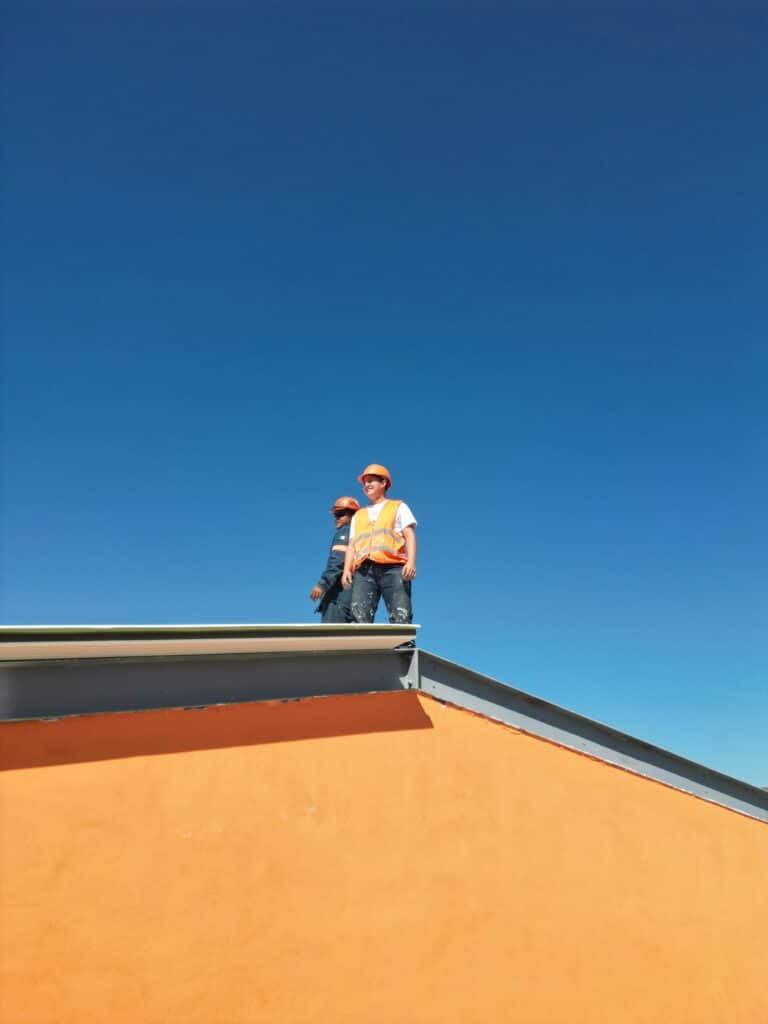 image of contractors on the roof