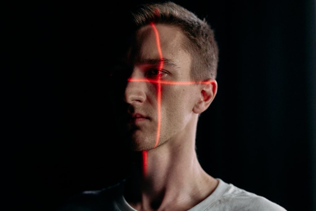 image showing a person using a facial recognition heading an article about facial recognition technology