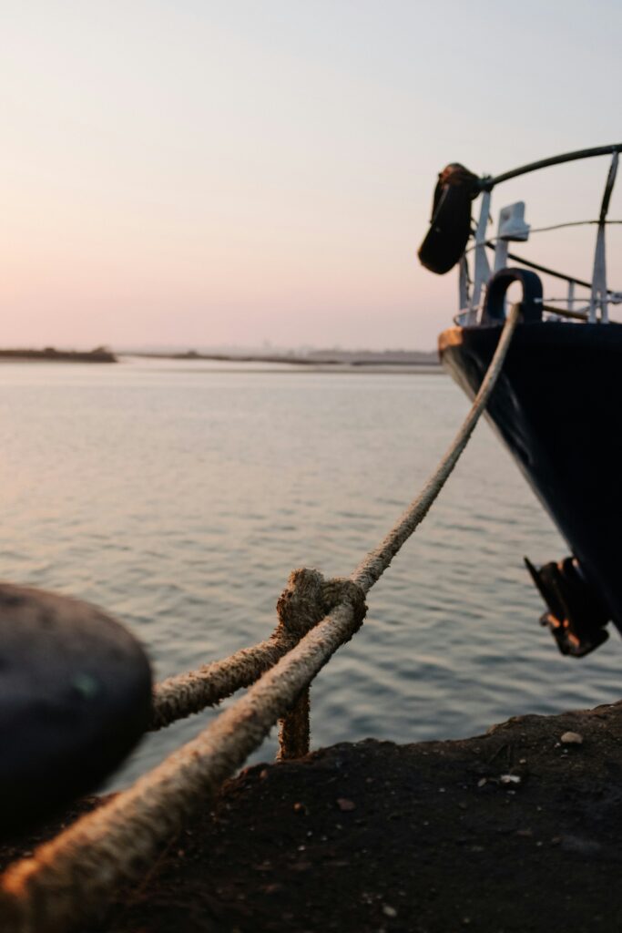 image of a boat tied to the shore inside an article by EM Law about bounding contracts and elements of a contract