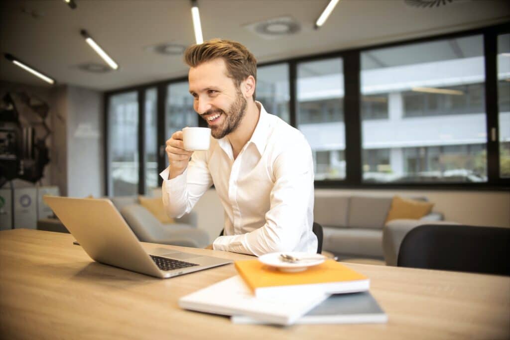 image of a man enjoying a cup of coffee heading an article about non-compete clauses