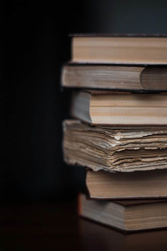 image of a stack of old books heading an article by EM Law about latin words, their use in law and their meanings in 