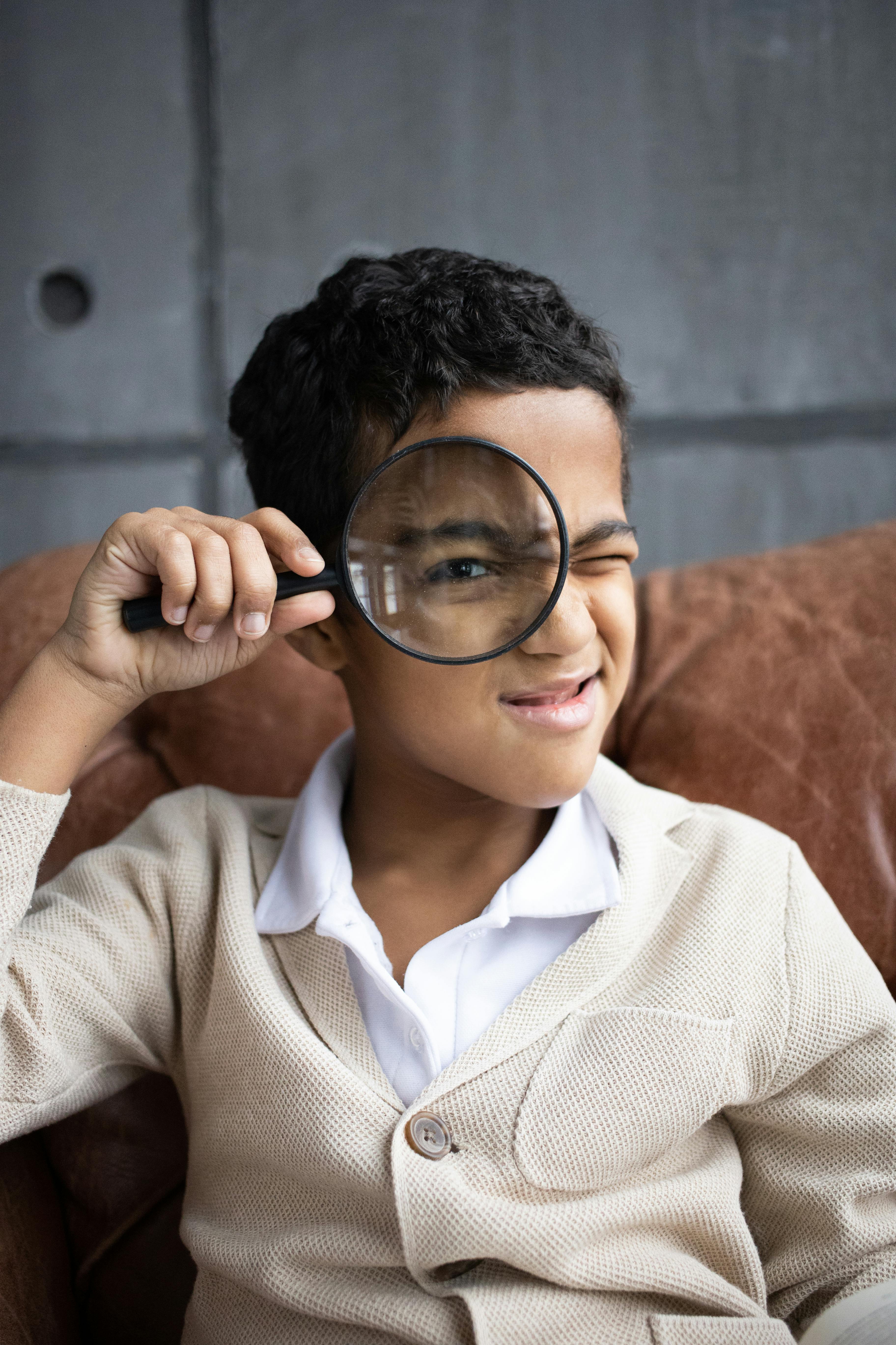 image showing a boy holding and looking through a magnifying glass heading an article by EM Law about prima facie