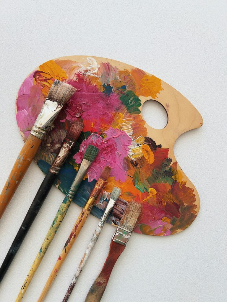 image of colourful paintbrushes inside an article by EM Law on copyright 