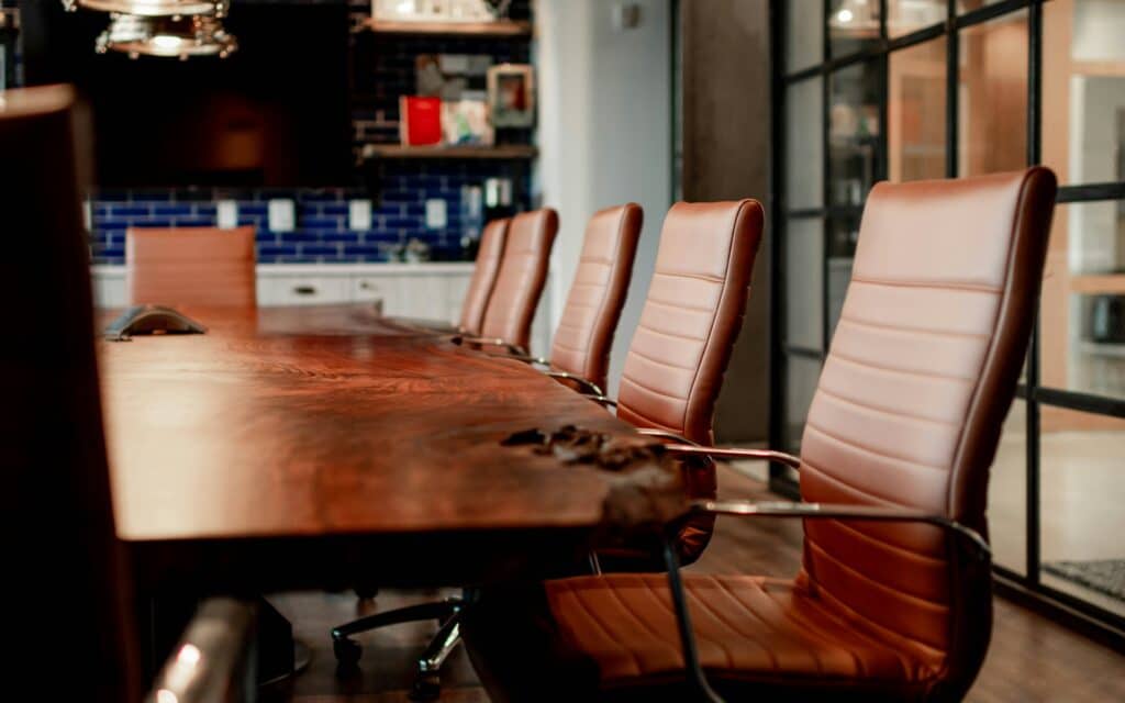 image of empty seats in a meeting room inside EM Law article about statutory redundancy