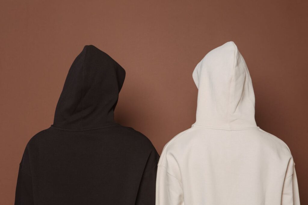image of two figure hidden in hoodies