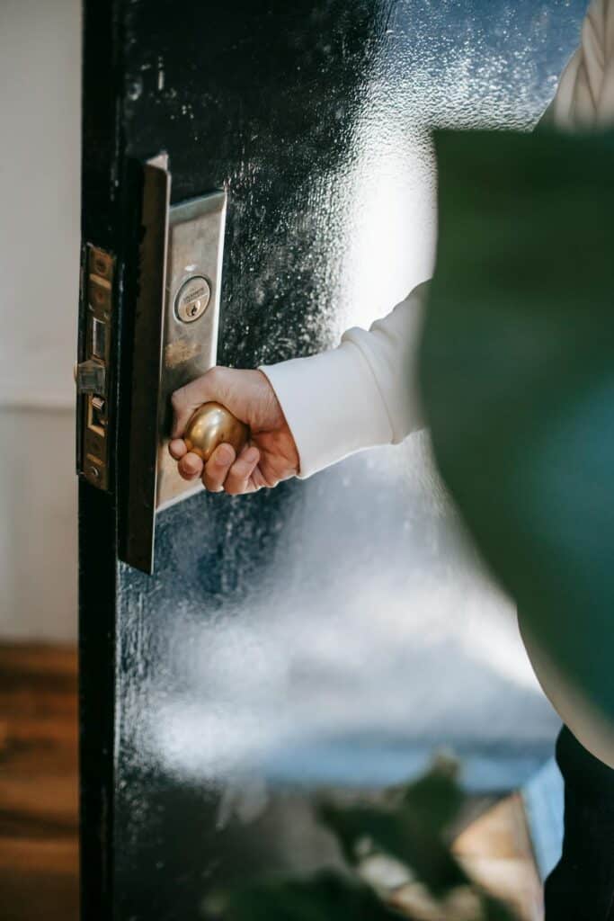 a hand opening doors