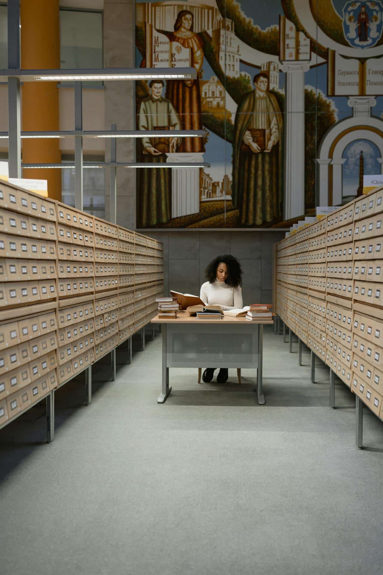 a woman sitting at a desk with database around her