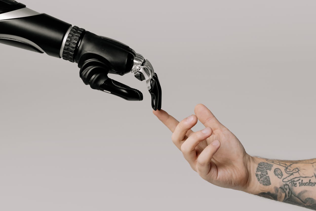 a human hand touching the hand of AI robot