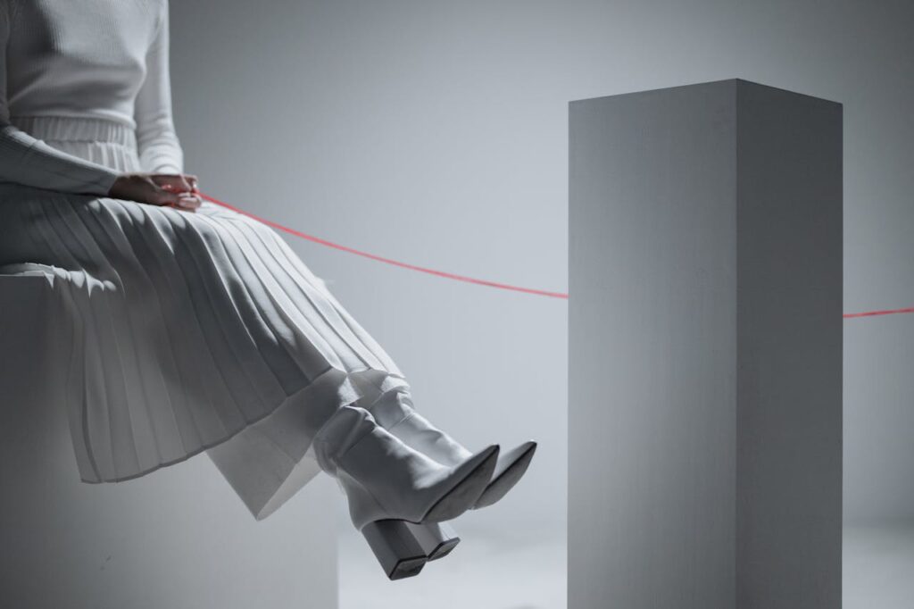 image of a person being linked with a red thread