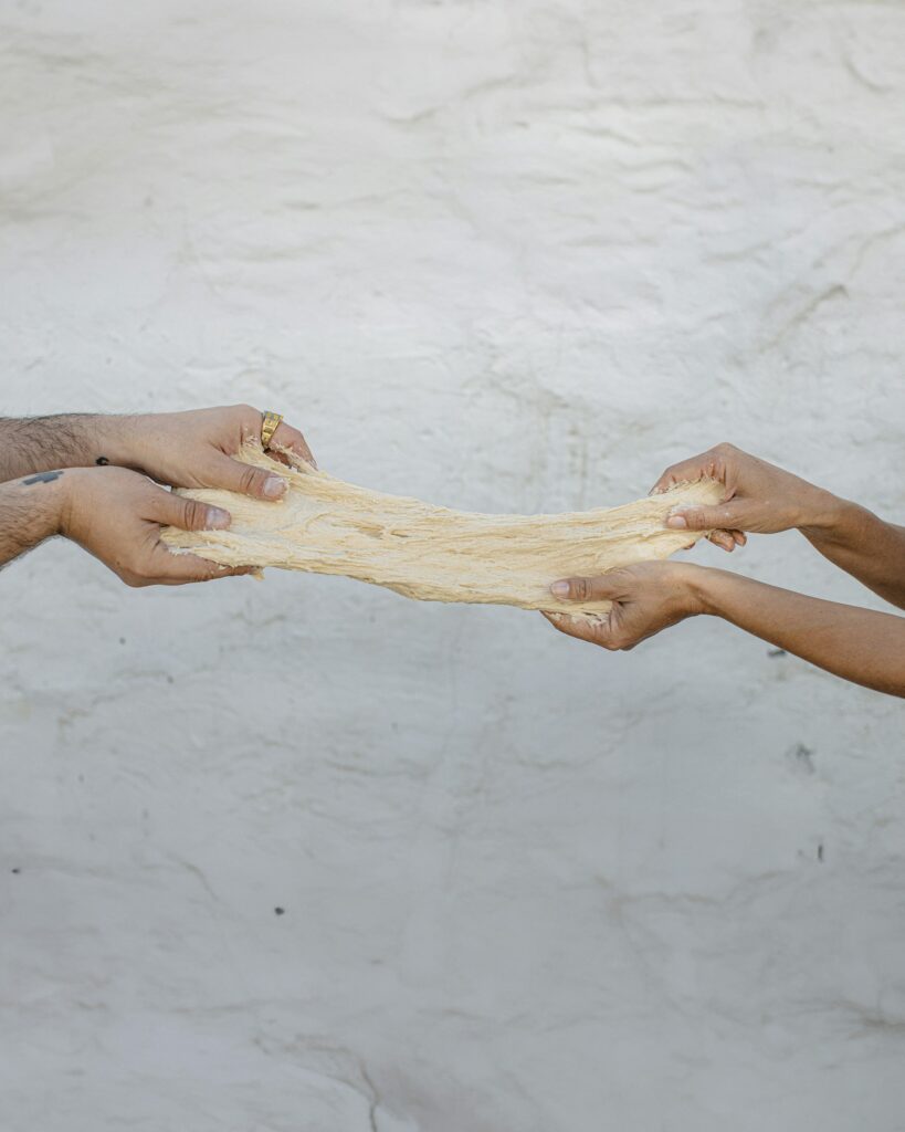 image of hands holding a dough