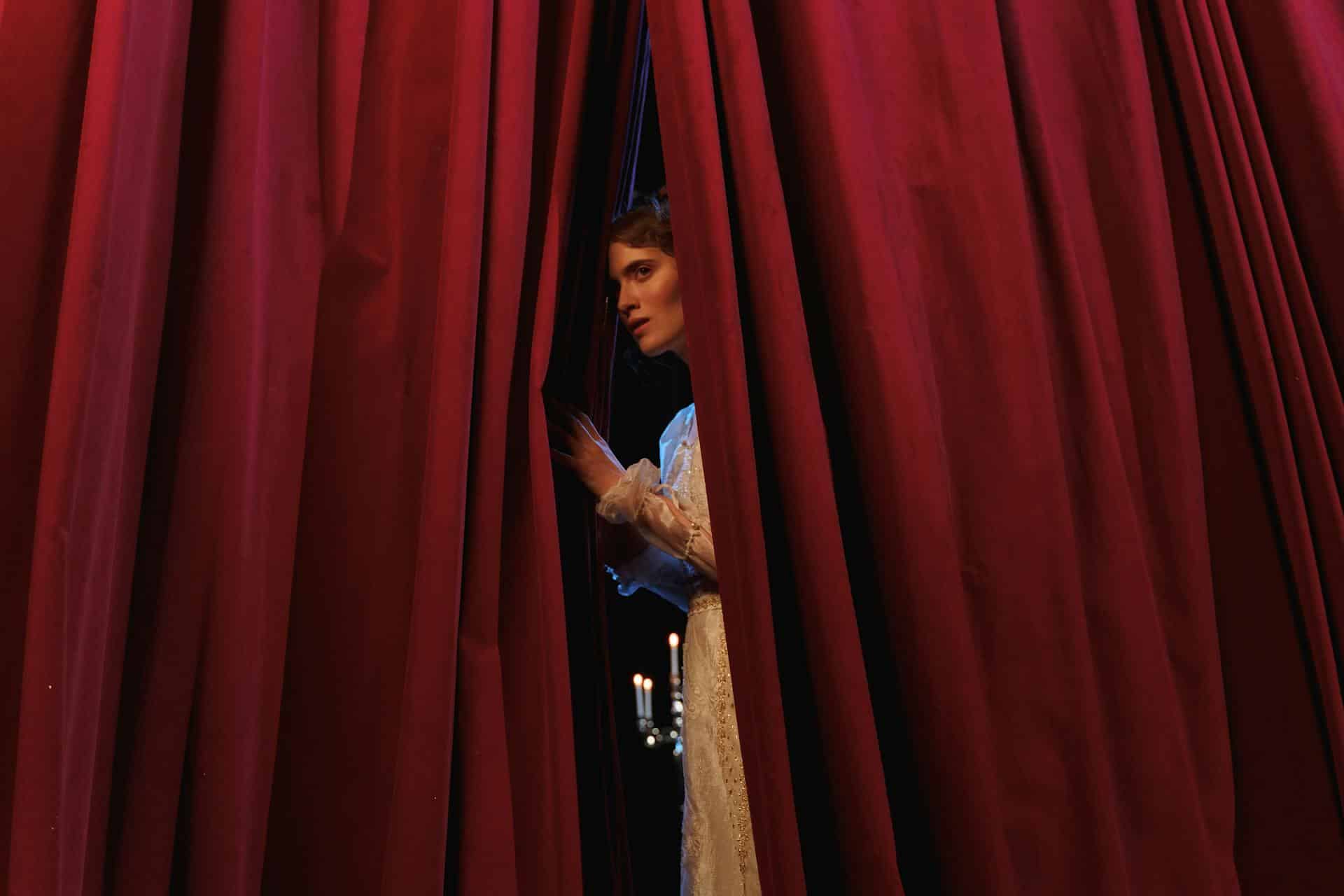 a woman behind a curtain - representing implied terms