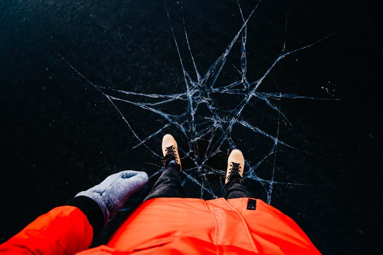 image of a man with a cracked ice underneath him