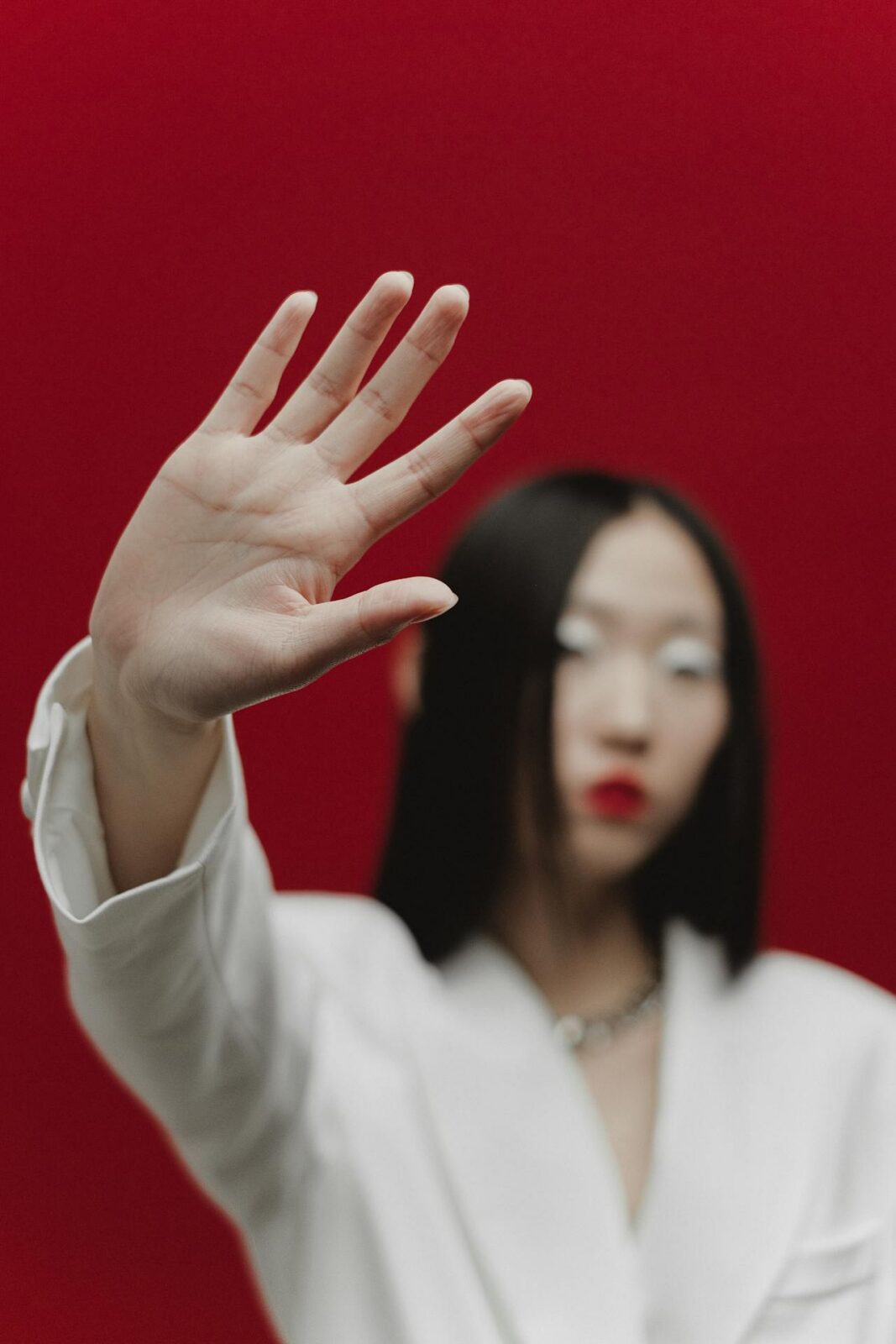 image of a woman raising a hand