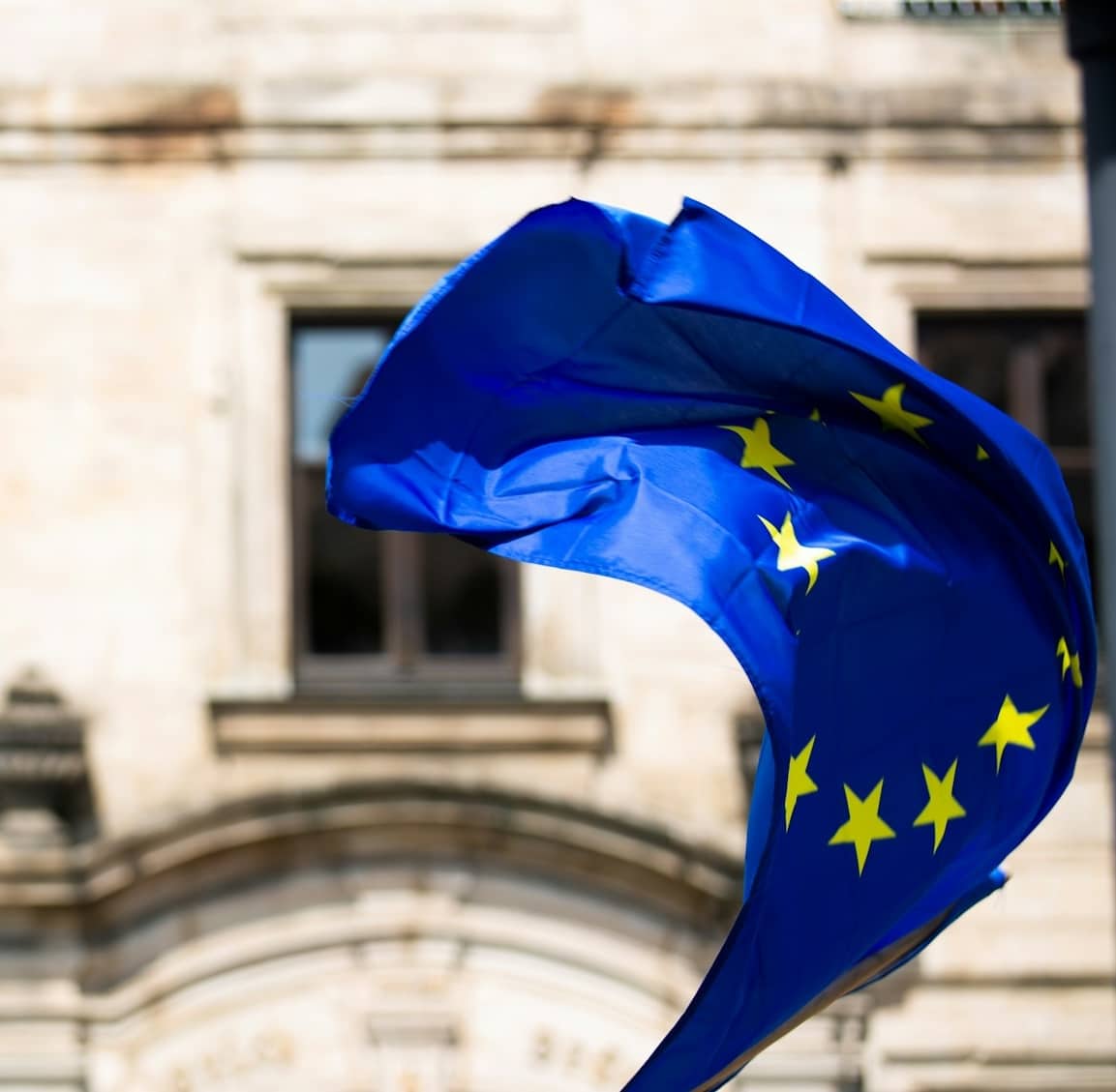 EU flag waving in the wind in EM Law blog about Consent and Email Tracking Pixels