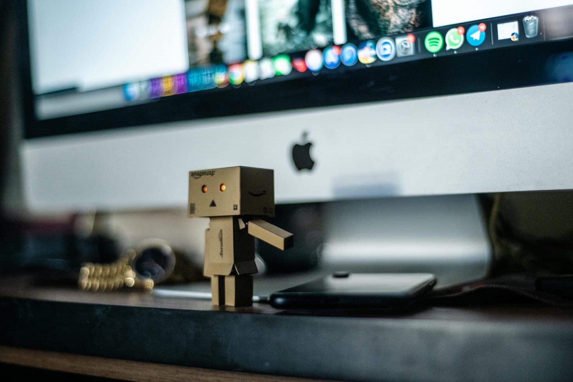 Small robot in front of computer in EM Law blog about Consent and Email Tracking Pixels