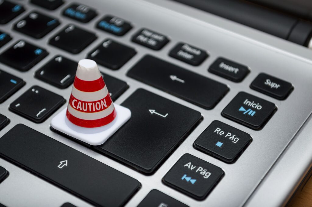 Image of a cone on an enter key on a keyboard in an EM Law blog about legal AI
