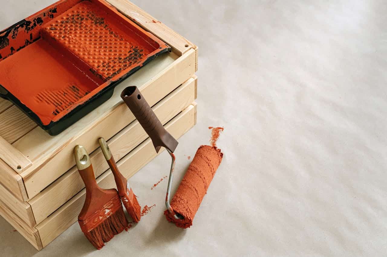 Image of paint brushes in a household setting in an EM Law blog on forfeiture of a commercial lease