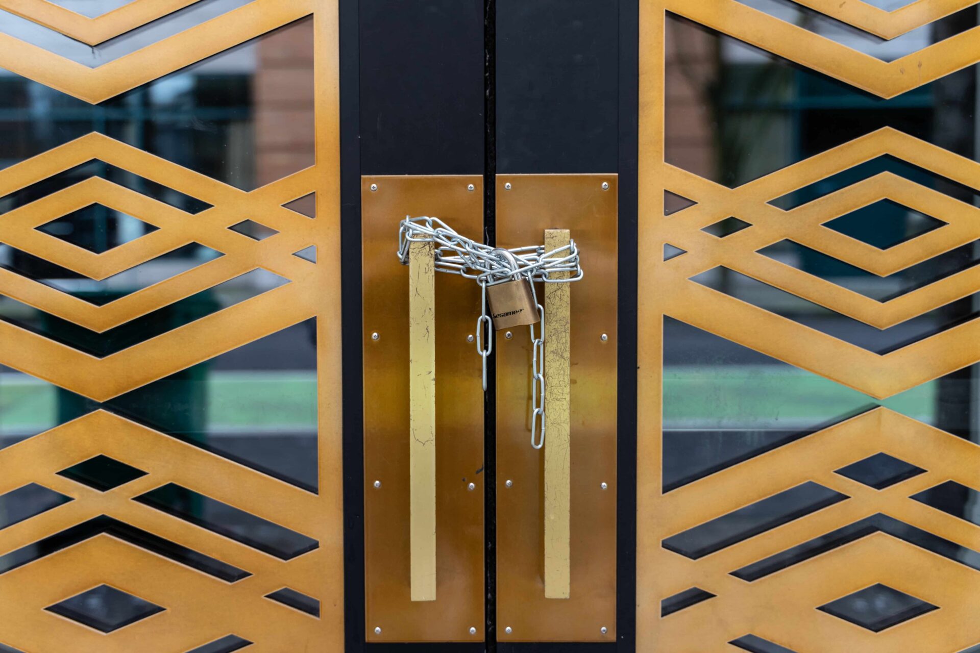 Chains locking up an office building, possibly as part of a forfeiture of a commercial lease EM Law